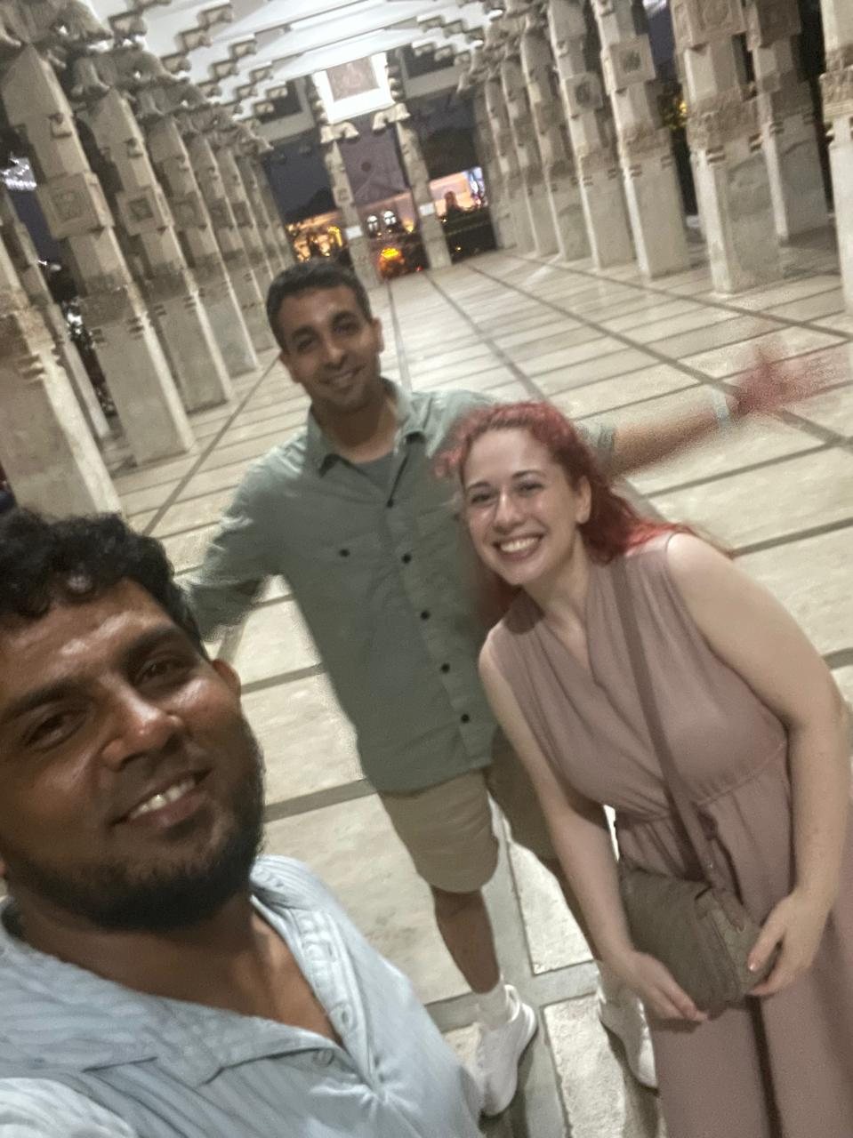 Local guide and travellers enjoying a Colombo temple visit after dark